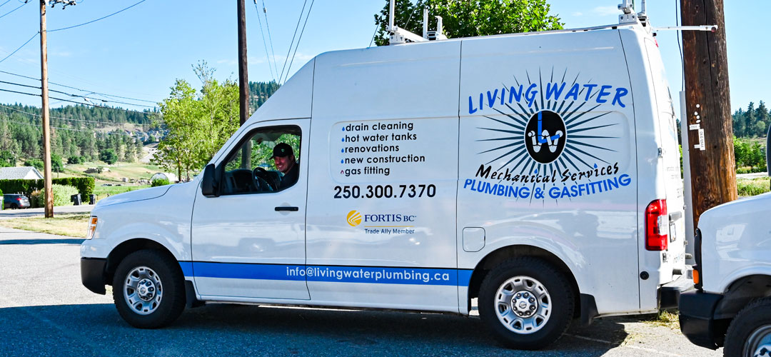 living_water_mechanical_kelowna_plumbing_man_driving_van